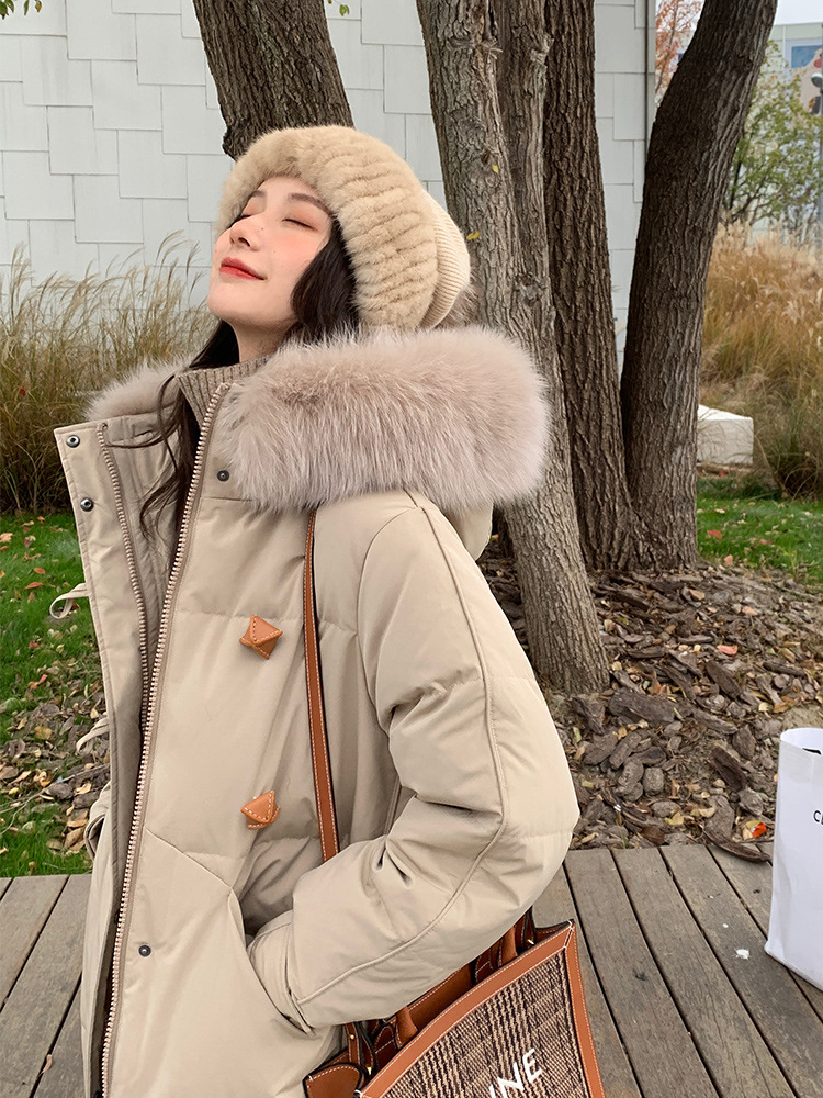 The new mid-length, fashionable, large-collar, loose and thickened white duck down warm jacket for women in winter 2021 is trendy