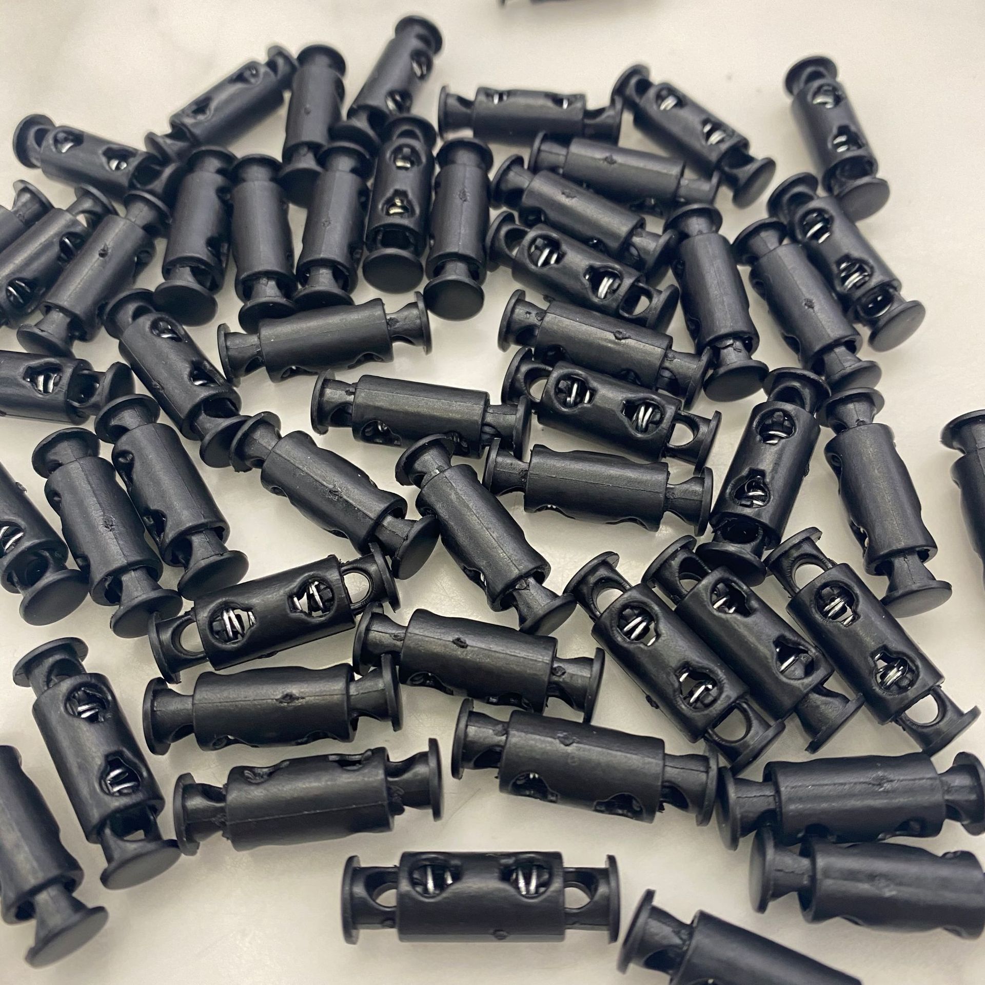 Plastic rope buckle, spring buckle, fixed buckle, adjusting buckle, double-hole cylindrical rod, rope buckle, elastic band, fixed snap buckle Item Picture