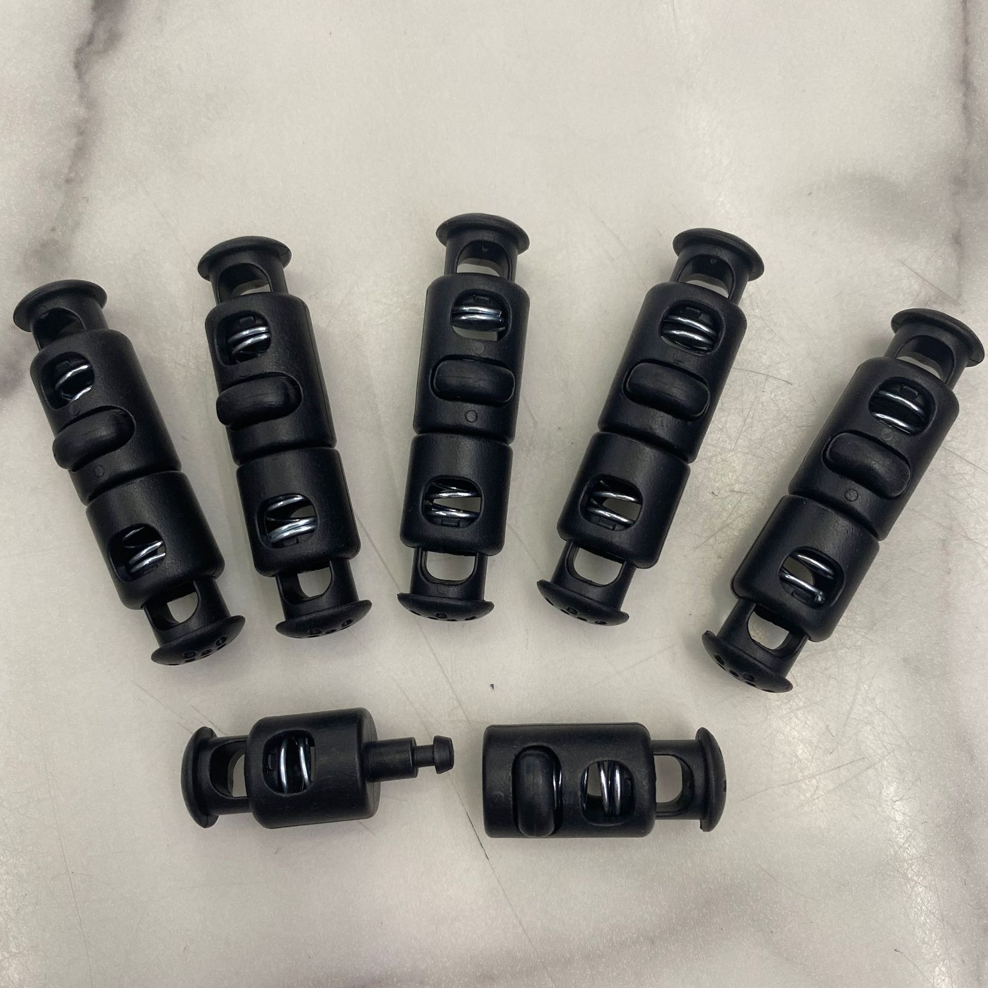 Plastic rope buckle, double-hole spring buckle, rope tail elastic buckle, plastic adjustable buckle, detachable spring buckle, in stock, quick delivery Specification image