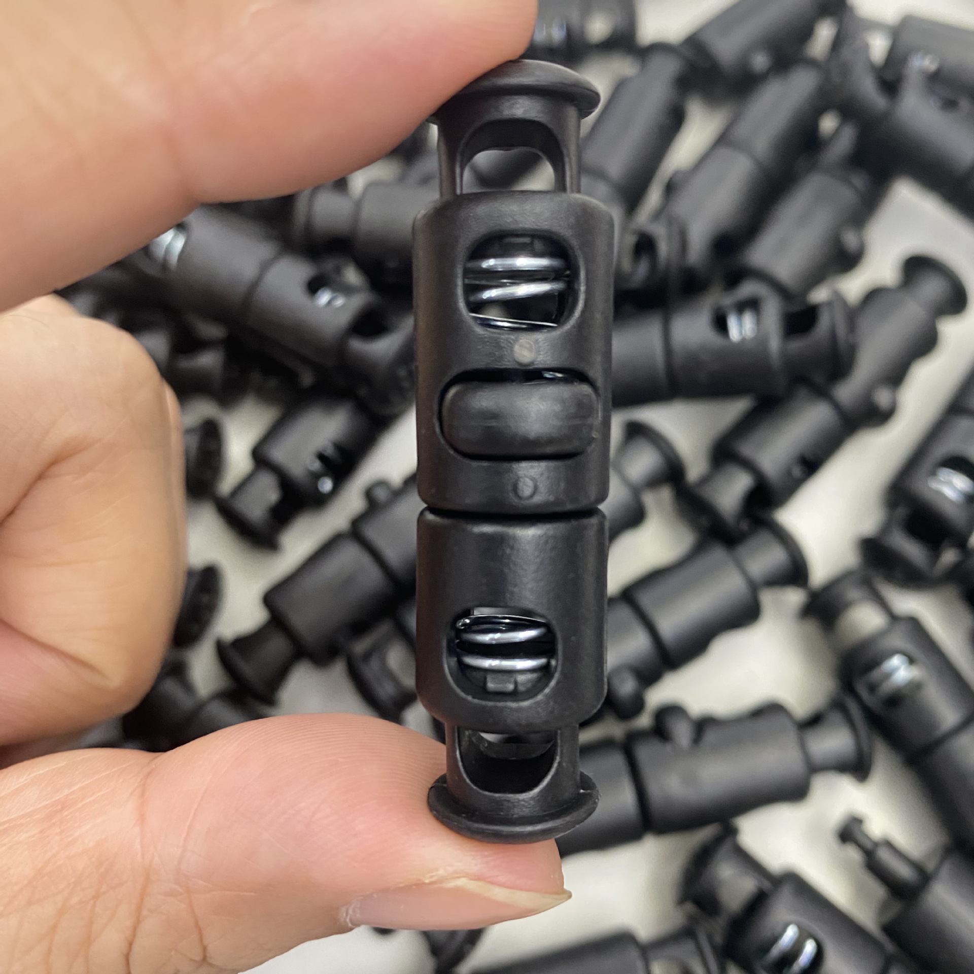 Plastic rope buckle, double-hole spring buckle, rope tail elastic buckle, plastic adjustable buckle, detachable spring buckle, in stock, quick delivery details Picture