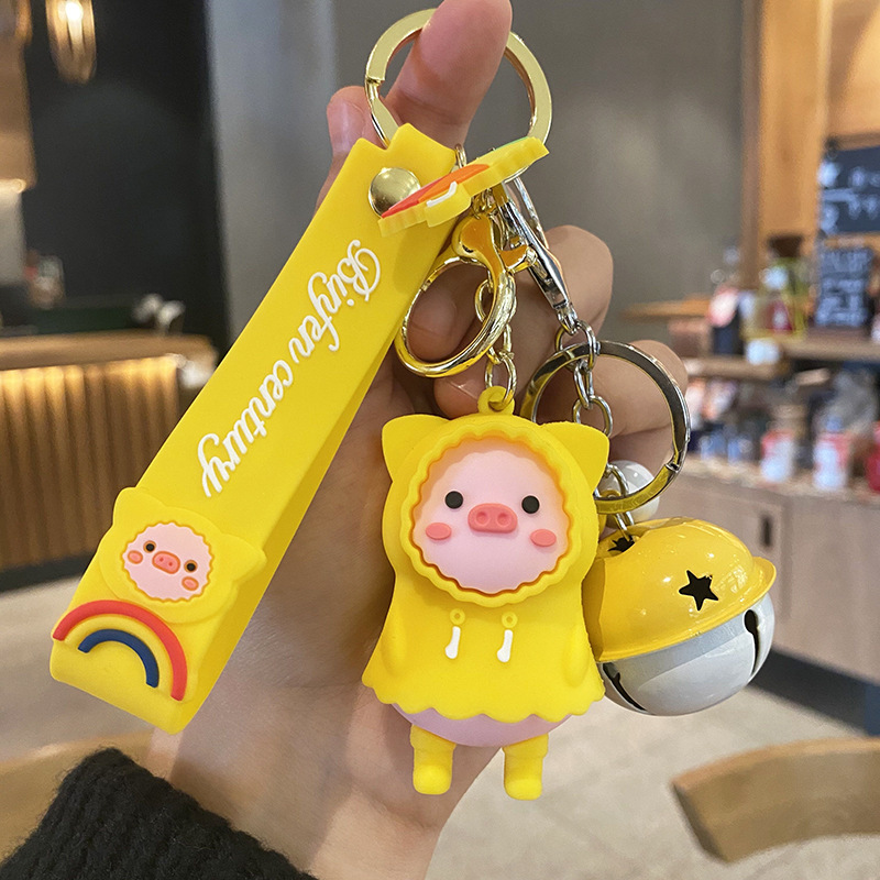 Cute raincoats, pig keychains, creative three-dimensional cartoon car keychain rings, couple bags, pendants, women's gifts wholesale Specification image