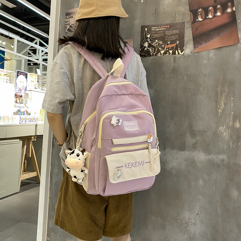 The new high-capacity ulzzang backpack for junior high school students in Korean high school color contrast is an ins backpack
