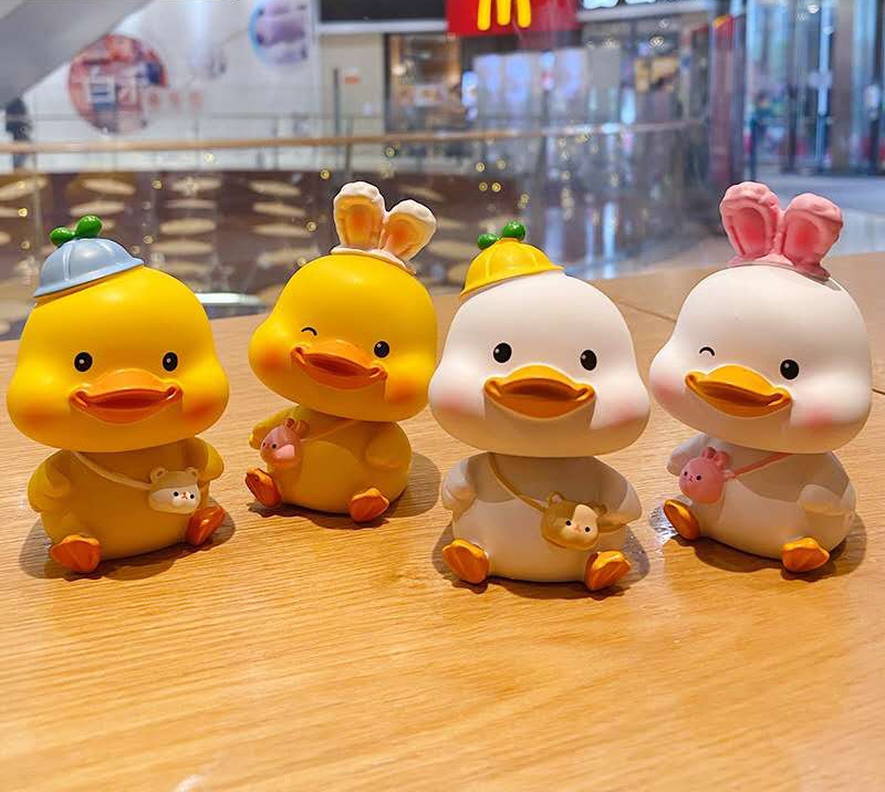 New original duckling shaking head car decoration, cute plush toy, creative home desktop decoration, as a gift for friends Application Scenario