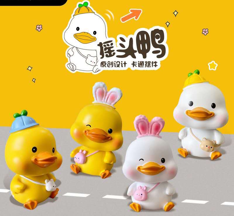 New original duckling shaking head car decoration, cute plush toy, creative home desktop decoration, as a gift for friends full figure