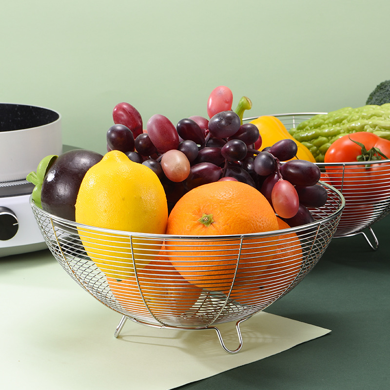 Wholesale stainless steel fruit baskets, household draining baskets, vegetable baskets, round three-legged storage baskets, and kitchen small tools details Picture