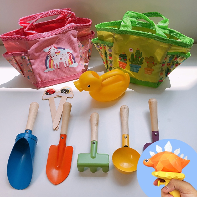 Children's sand-digging shovels, beach toys, cassia seeds, sand-playing outdoor tools, handbag sets, water guns h for export to Germany full figure