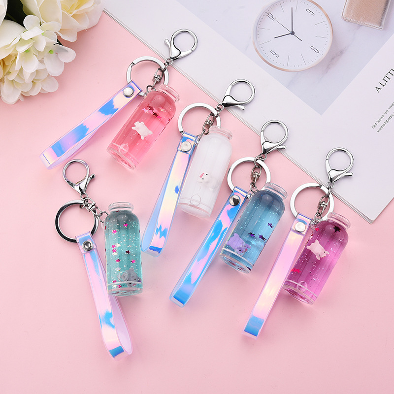Internet-famous floating milk, pig, flowing sand keychain, liquid floating milk bottle pendant, pig claw machine doll small gift