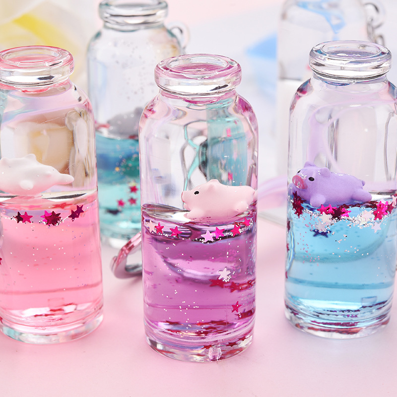 Influencers leche flotante cerdo arena movediza llavero deriva líquida colgante botella de leche cerdo agarrador muñeca pequeño regalo Specification image