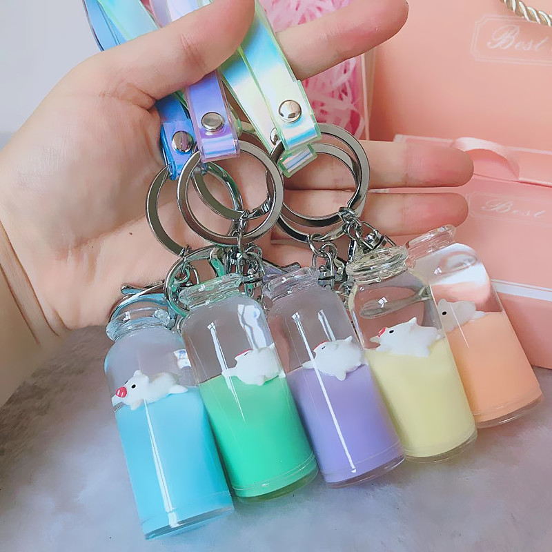 Douyin with jelly color floating milk pig key chain liquid floating milk bottle pendant pig claw machine doll