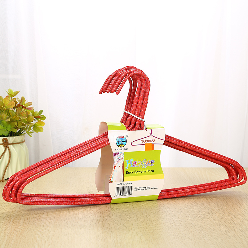 The manufacturer wholesals household anti-slip and traceless drying plastic-coated clothes hangers. The simple solid color thickened 10-piece hangers are selling well details Picture