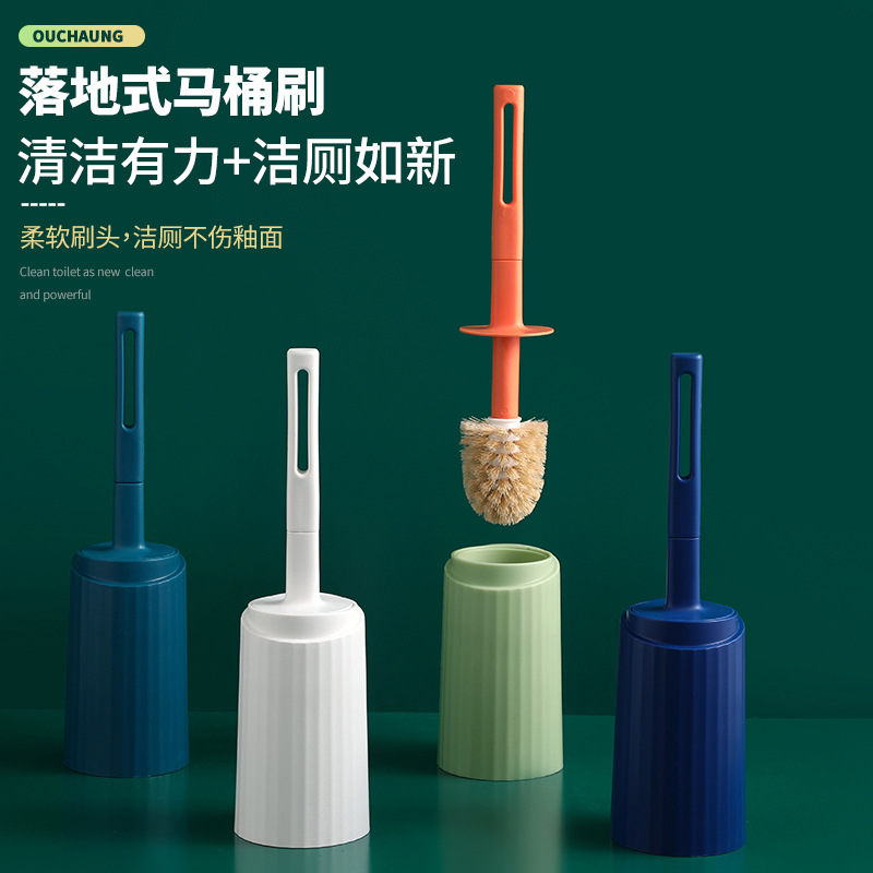 A household plastic floor-standing toilet brush with a base and a long handle for cleaning the toilet without drilling