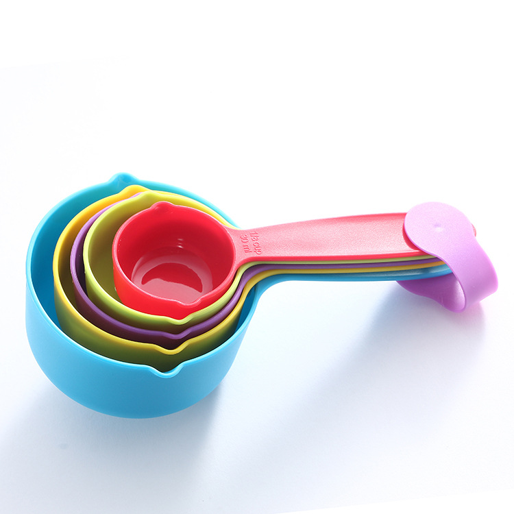 A set of 5 large colored plastic measuring spoons and cups for kitchen baking tools and flour baking measuring spoons