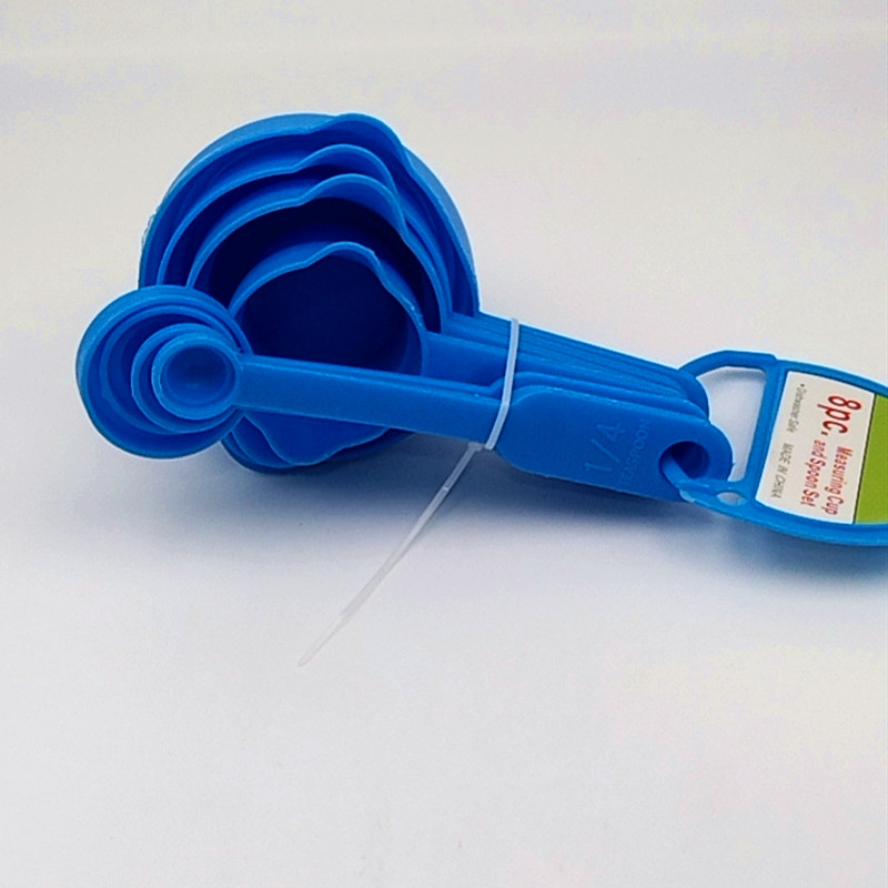A 10-piece set of multi-functional plastic measuring cups and spoons for the kitchen, baking tools with scale measurement