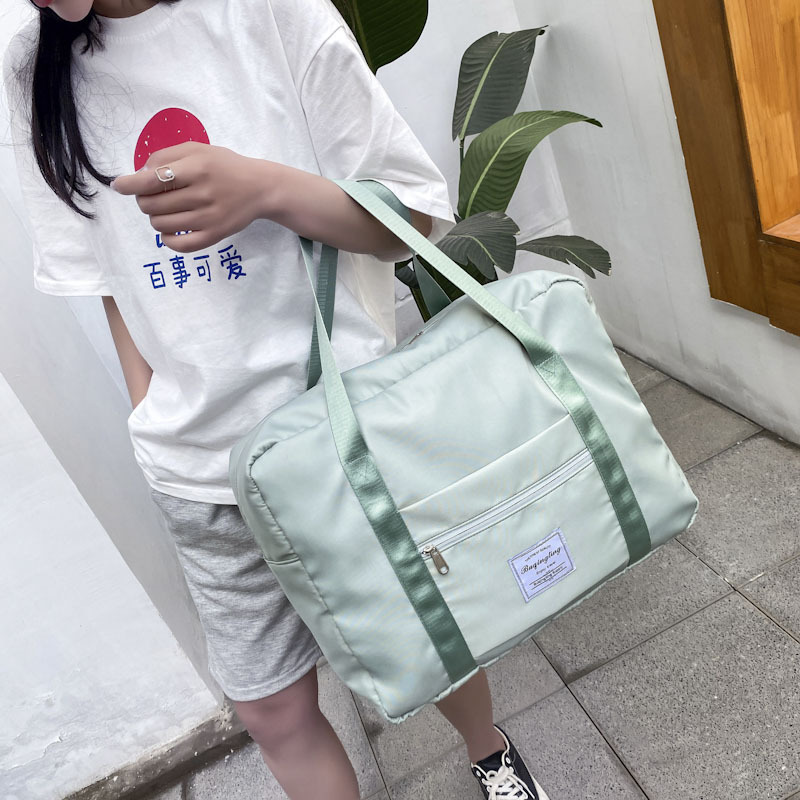 Bolsa de almacenamiento de mano de viaje de gran capacidad para las mujeres pequeña bolsa de estudiante ligera puede ser cubierta con caja de barra de estiramiento bolsa de viaje de corta distancia Application Scenario