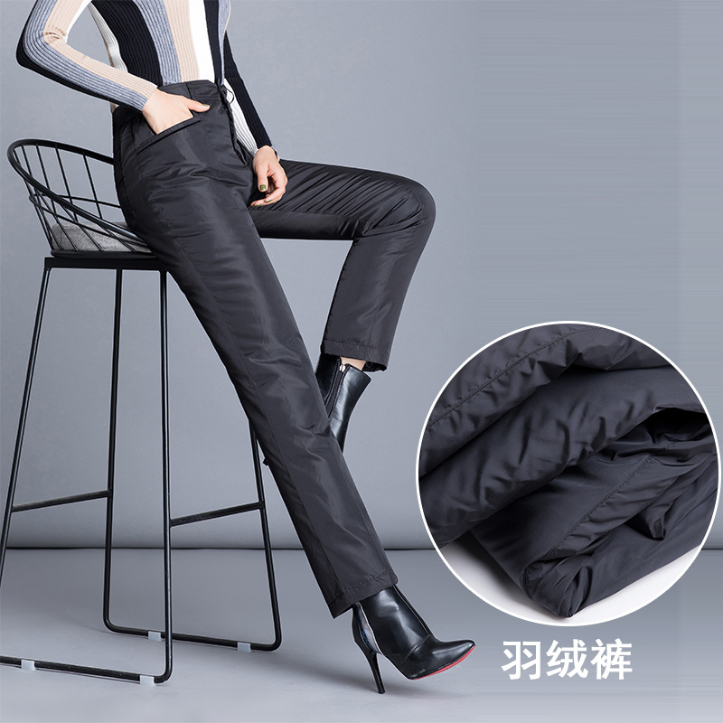 Middle-aged and elderly women wear down pants as outerwear. Large-sized, high-waisted, thickened down pants for mothers can make them look slimmer and keep them warm both inside and out in winter