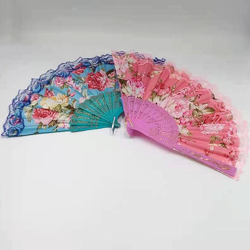 This trendy and fashionable lady fan is convenient to carry. It is made of lace printed silk fabric and is a high-end folding fan for dancing details Picture