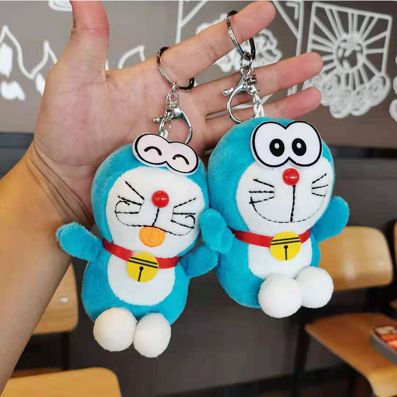 Cute plush machine cat key chain bag pendant doll toy claw machine doll jingle cat key chain wholesale