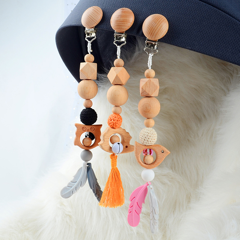 Baby teething rings, stroller pendants, wooden fitness toys, music bells, silicone pacifier holders
