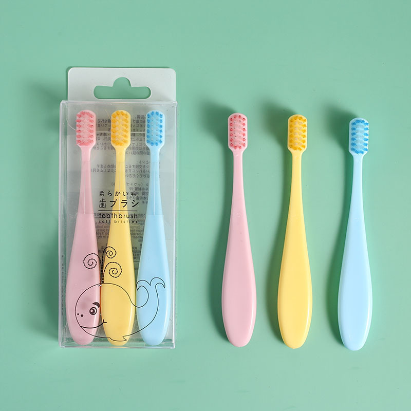 The popular and best-selling creative macaron children's three-piece set children's toothbrush with soft bristles and candy-colored cartoon features is a gift from the baby store details Picture