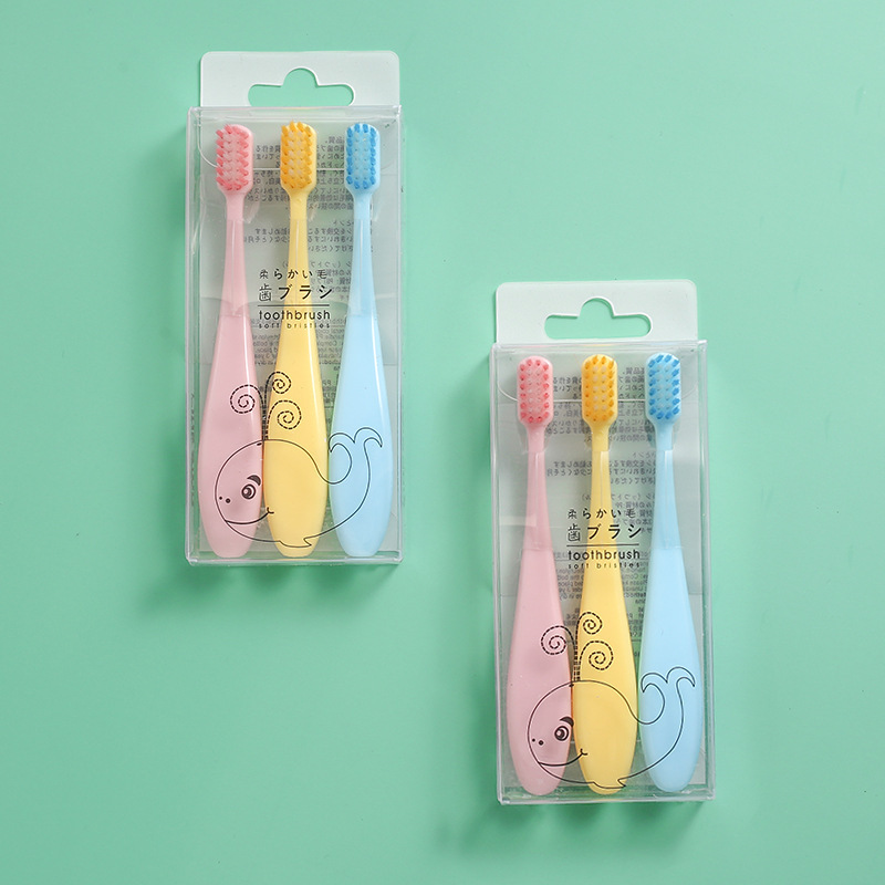 The popular and best-selling creative macaron children's three-piece set children's toothbrush with soft bristles and candy-colored cartoon features is a gift from the baby store full figure