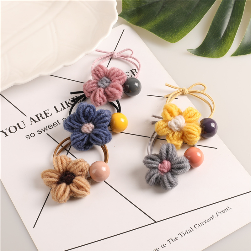 The new autumn and winter style of the popular Instagram forest-themed hair band features a high-elasticity knitted flower hair tie with a hair tie band