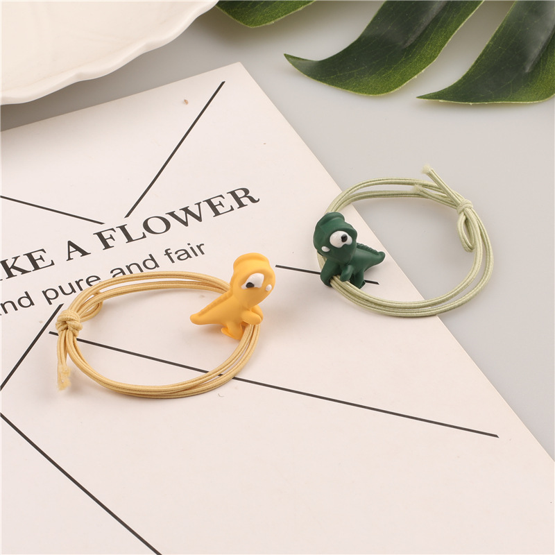 Wholesale supply of Korean cartoon threading three-dimensional dinosaur hair bands, high-elasticity hair tie rubber bands, and King Dragon hair ropes Application Scenario
