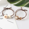 Korean version of the popular ins milk tea-colored M-bean hair band, high-elasticity hair tie rubber band, two-yuan store wholesale hair accessory supply details Picture