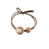 Korean version of the popular ins milk tea-colored M-bean hair band, high-elasticity hair tie rubber band, two-yuan store wholesale hair accessory supply Item Picture
