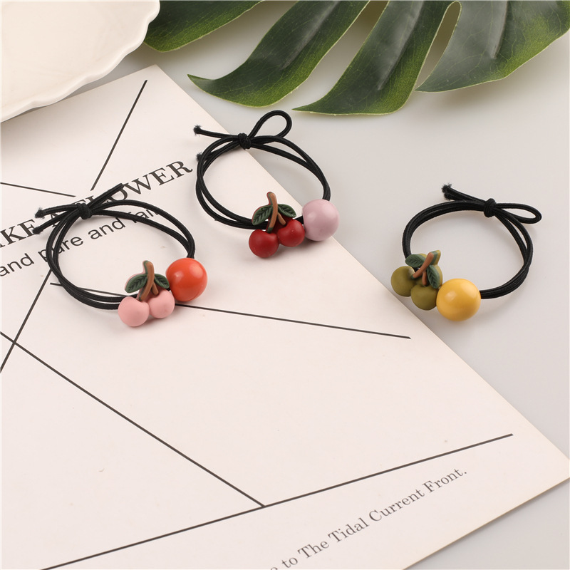 Korean version of ins cartoon cherry hair bands, black thread hair ties, high-elasticity hair ties, 2-yuan store wholesale supply Application Scenario