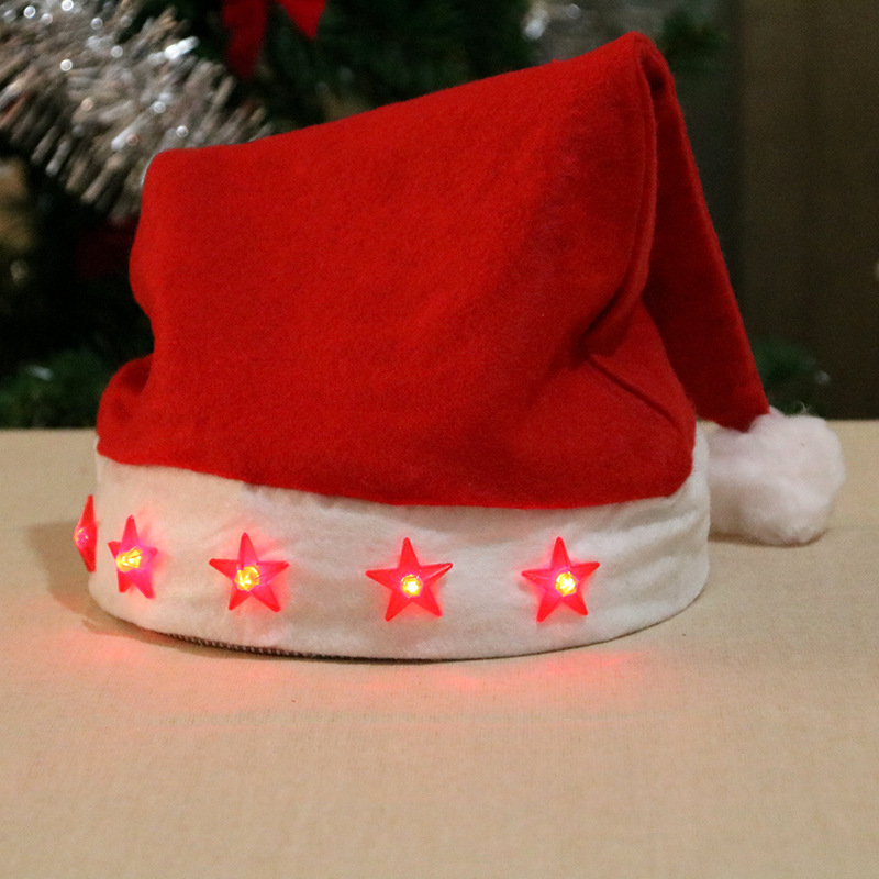 A five-pointed star, a shining Santa hat, a Santa hat, a Christmas ornament, a shining Santa hat, an adult