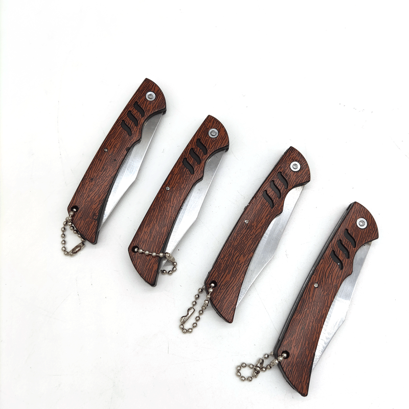 Two-yuan store wood-grain fruit knife, household foldable knife for peeling potatoes, portable wooden handle knife wholesale Application Scenario