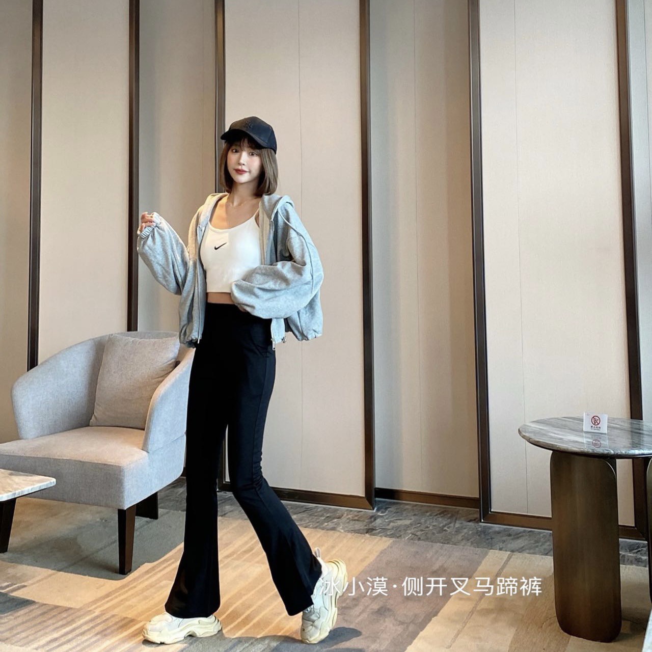 The 2022 new black side-slit horseshoe pants feature a tall, elongated design with a niche, high-waisted, tight-fitting look that accentuates women