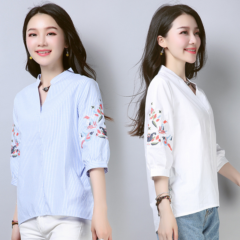 This is a new Spring/Summer 2022 embroidered striped shirt for women with a seven-inch lantern sleeve, loose V-neck and Korean style, featuring a short front and long back Application Scenario