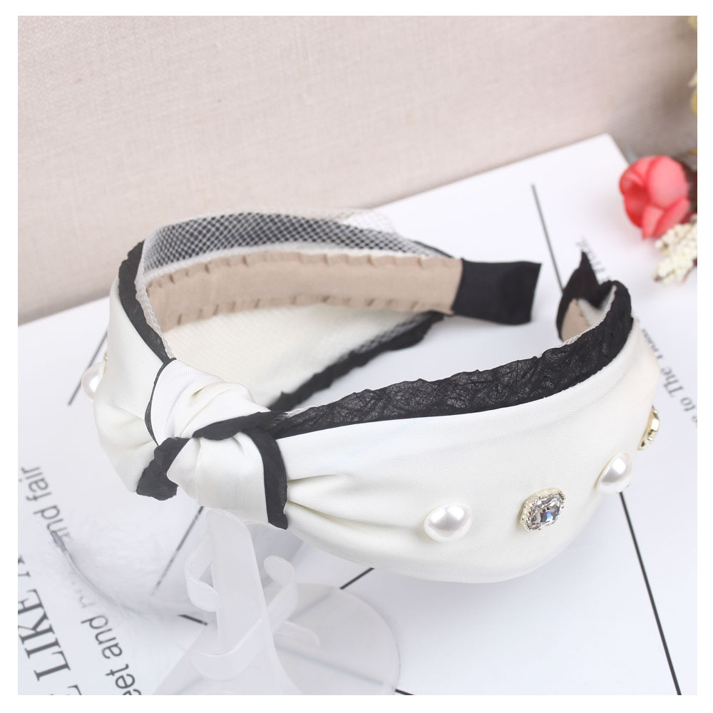 Wholesale of accessories: Asymmetrical bow wide-edge hair bands for women, Korean Internet celebrity hair clips, simple and versatile hair accessories headbands Item Picture