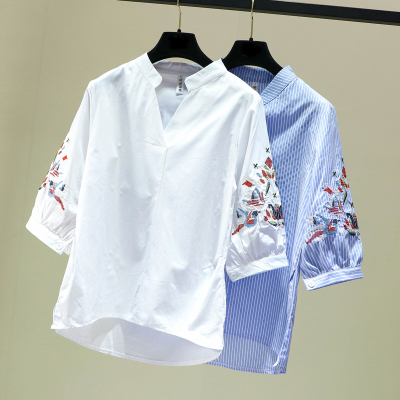 This is a new Spring/Summer 2022 embroidered striped shirt for women with a seven-inch lantern sleeve, loose V-neck and Korean style, featuring a short front and long back