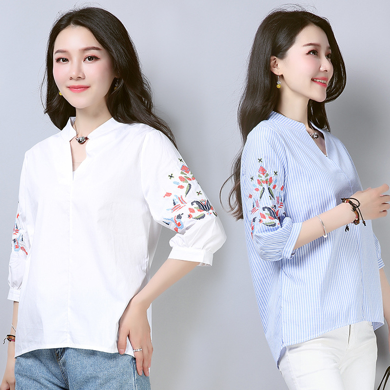 This is a new Spring/Summer 2022 embroidered striped shirt for women with a seven-inch lantern sleeve, loose V-neck and Korean style, featuring a short front and long back details Picture