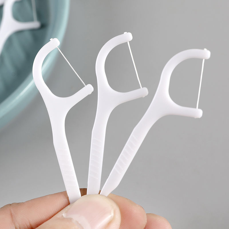 The manufacturer offers wholesale of disposable household floss and toothpicks, 50-piece fine floss sticks, toothpicks and floss in boxes Specification image