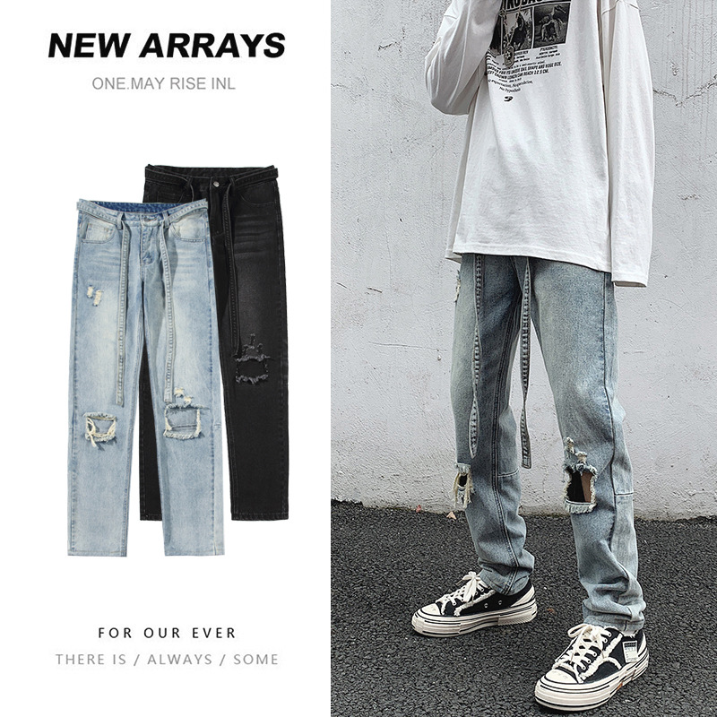 On the street, the knee is cut and the pants are ripped