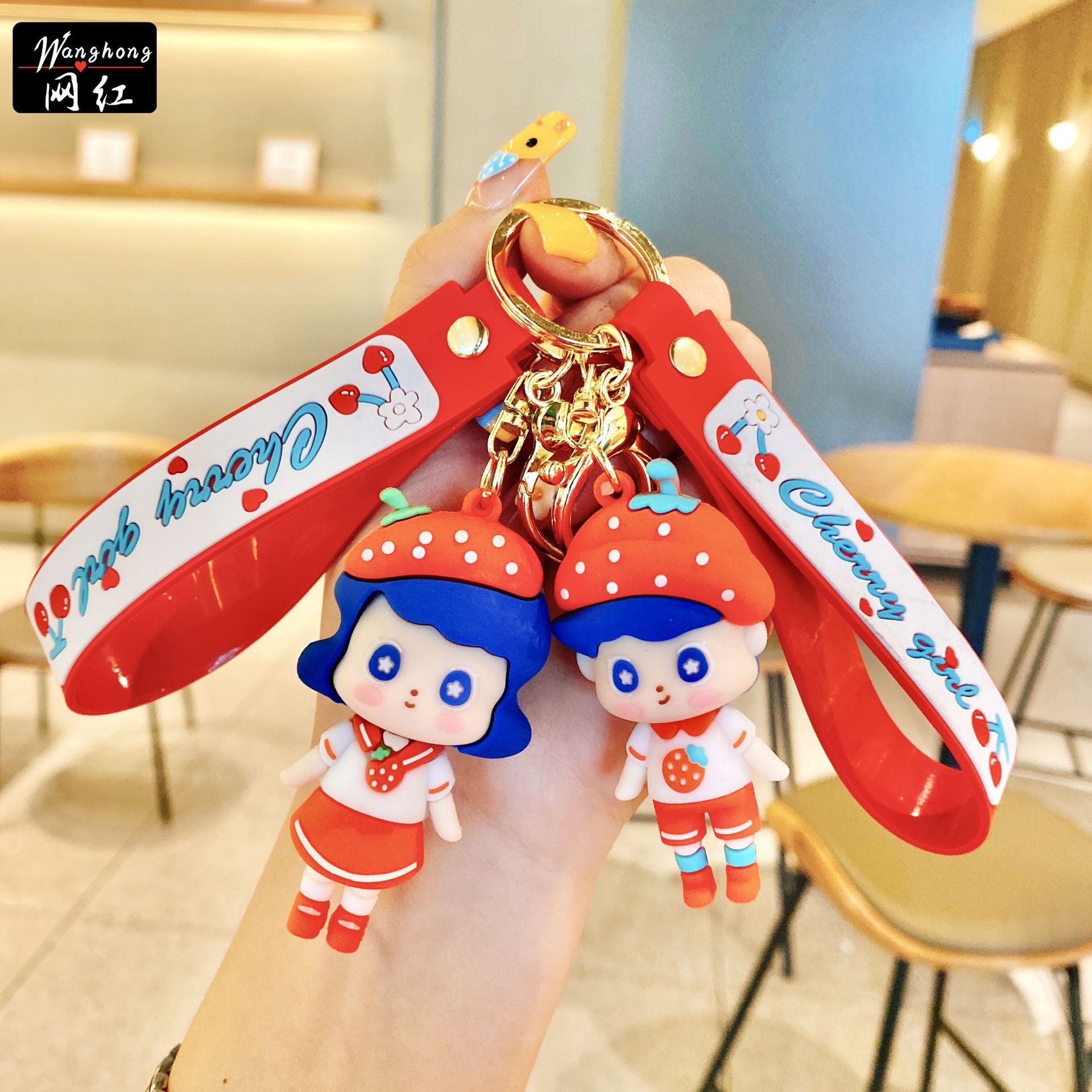 Wholesale of cartoon strawberry couple keychains, creative epoxy resin figurines, car key chains, accessories, cute bags and pendants