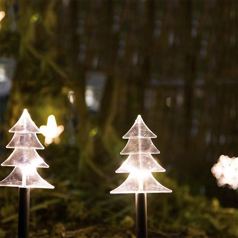 Snowflake stars in a row of five Christmas garden decorations solar lanterns in a row of lights thumbnail