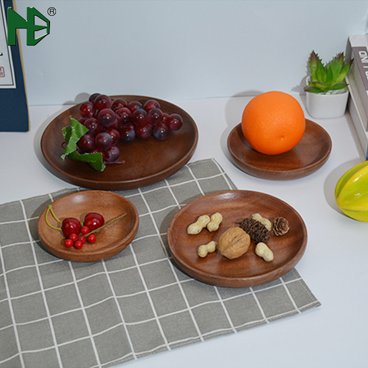 Wooden round black walnut wooden trays, fruit bread plates, baby dinner plates in various sizes are available for wholesale details Picture