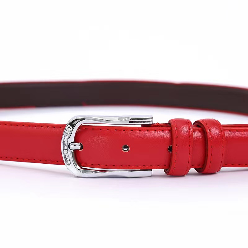 The trendy women's belt is simple and versatile, with a leather bottom and alloy pin buckle. The small apple women's belt manufacturer is selling it in stock Item Picture