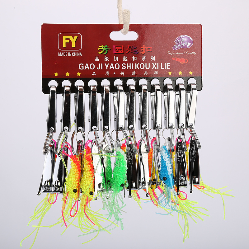 A 2-yuan store is selling hot nail clippers, cartoon metal, stainless steel nail clippers, ear spoons and keychains in 12-piece sets for wholesale