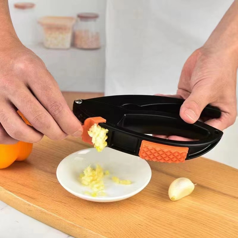 Amazon's in-stock plastic garlic puree and garlic paste applicator, multi-functional garlic press for vegetables, fruits, melons, and tender meat Specification image