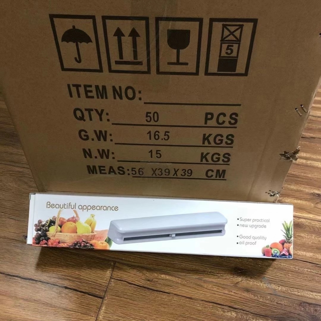 Nuevo tipo de ventosa cortador de película de plástico divisor de almacenamiento ajustable caja de corte creativo artículos de cocina comercio exterior