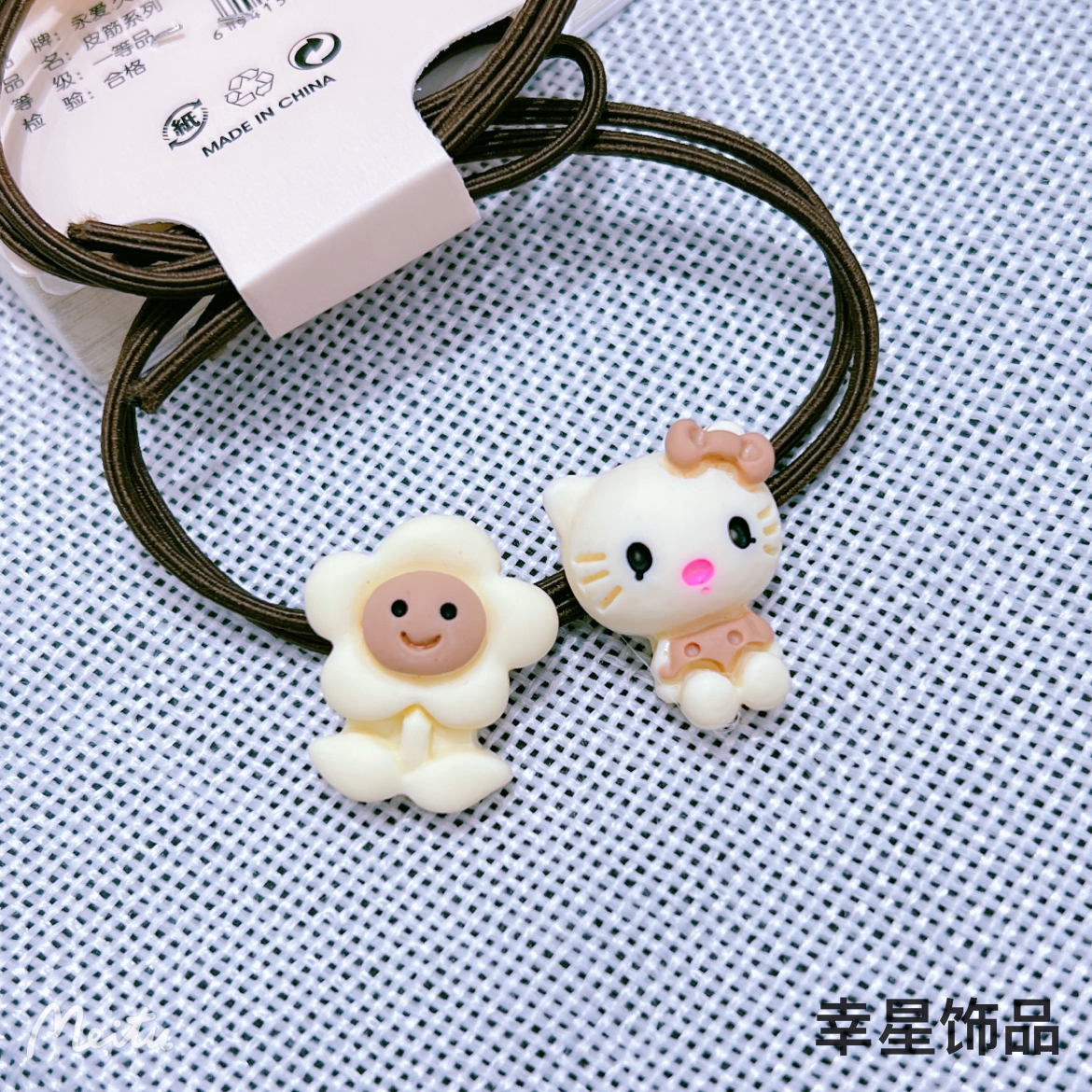 This trendy, simple and cute hair tie is in a milk coffee color with a high-end look. It features a cartoon hair tie tied in a ponytail and a rubber band hair band. It's a double-strip clip details Picture
