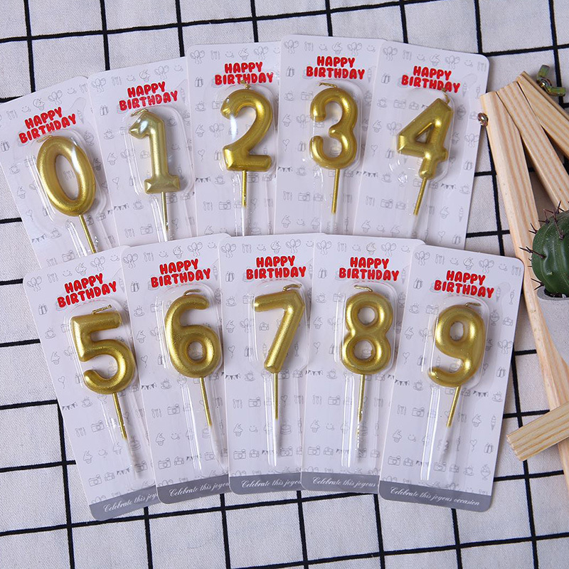 Creative birthday cake decoration with golden digital candles. Gold 0-9 full-size round-edge digital candles