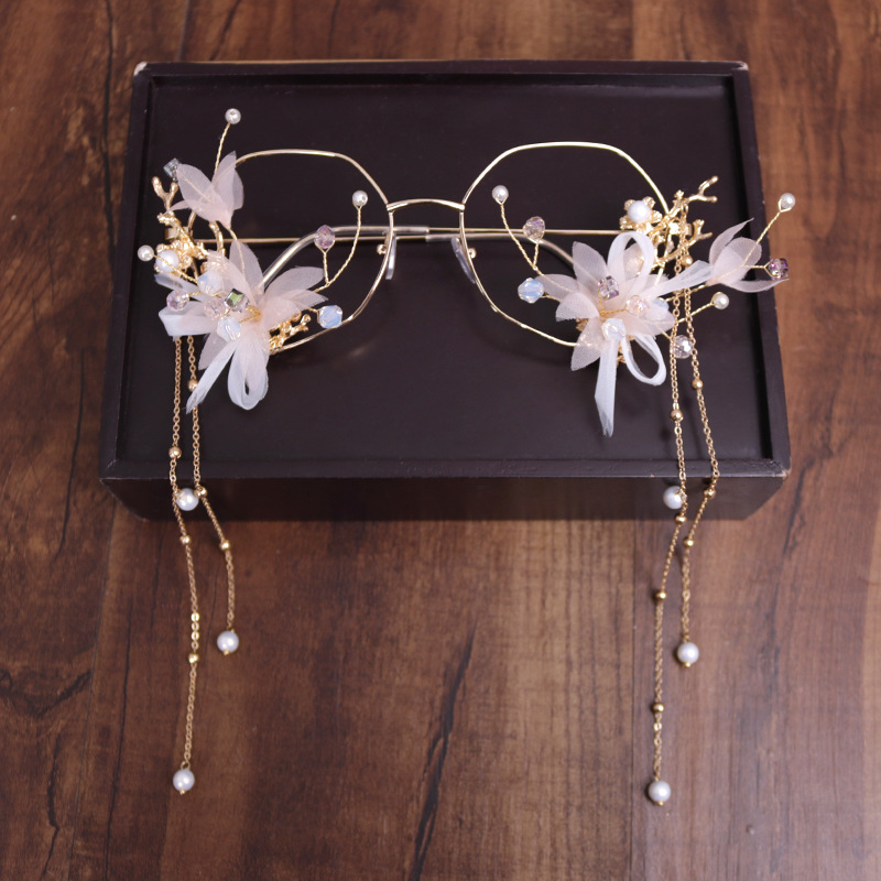 New fashionable and trendy glasses, simple bridal wedding pink tassel accessories, and golden forest-themed elegant hair accessories details Picture