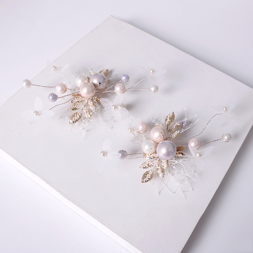 A pair of hair accessories featuring ethereal sequins, twisted silk, pink pearl hair clips, ear clips, fishing nets, and small white flower branches Specification image