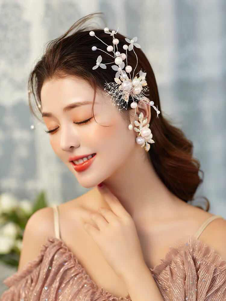 A pair of hair accessories featuring ethereal sequins, twisted silk, pink pearl hair clips, ear clips, fishing nets, and small white flower branches